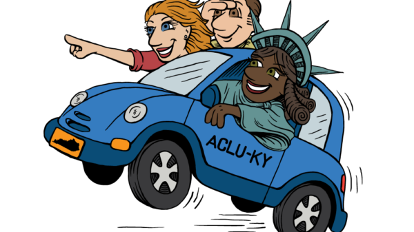 Car w/lady liberty and two other people in the car