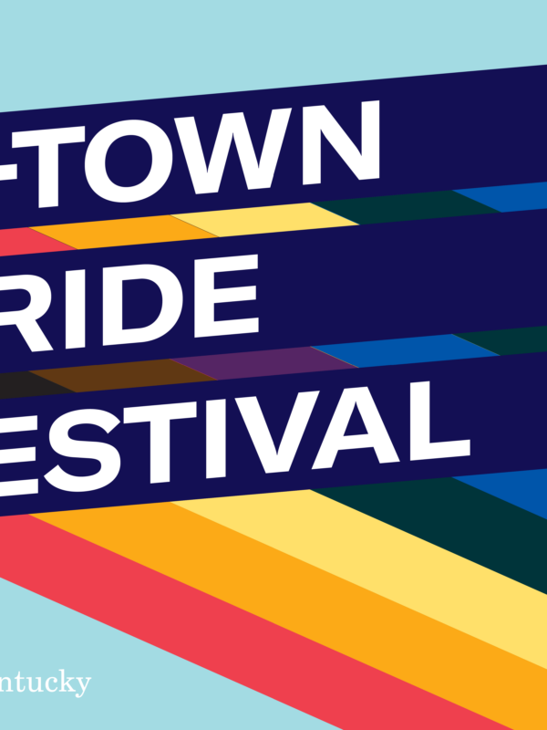 Graphic with light blue background and three slanted bars with rainbow stripes giving a 3D effect. Each bar has one line of text. Together the read, "E-Town Pride Festival"