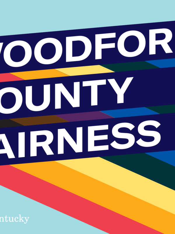 Graphic with light blue background and three slanted bars with rainbow stripes giving a 3D effect. Each bar has one line of text. Together the read, "Woodford County Fairness Meeting"
