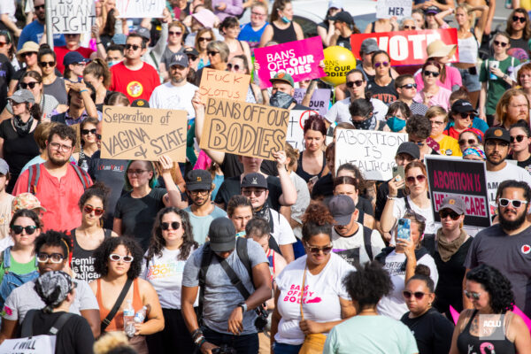 Abortion rights advocates holding protest signs