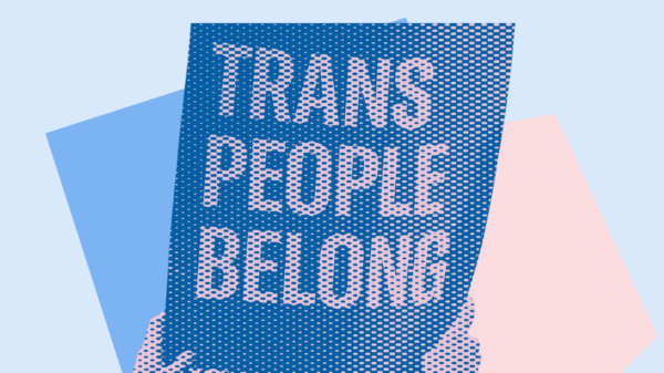 Hands holding a sign that says "trans people belong" on a pink and blue background
