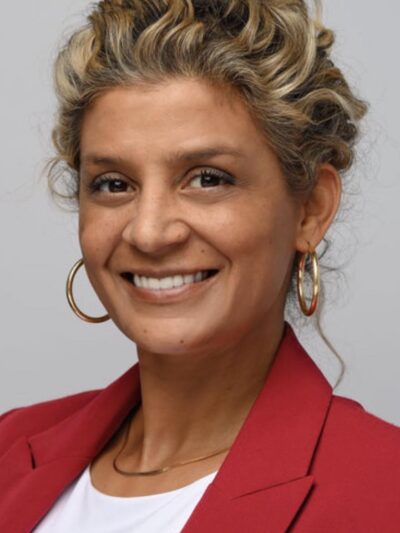 jackie dressed in red with a smile