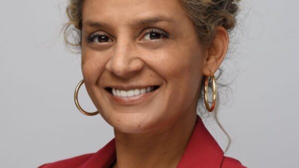 jackie dressed in red with a smile