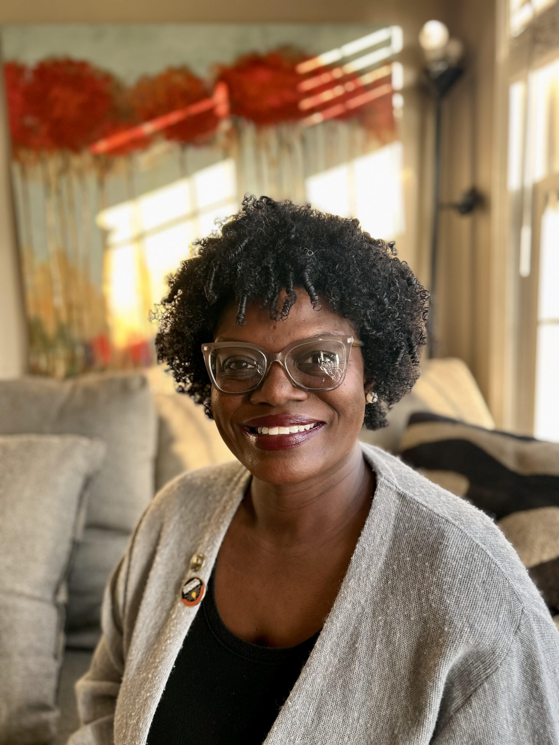 j reid wears glasses and a sweater