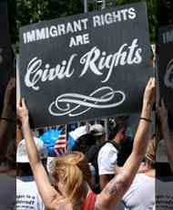 Woman holding sign that says &quot;Immigrant Rights are Civil Rights.&quot;