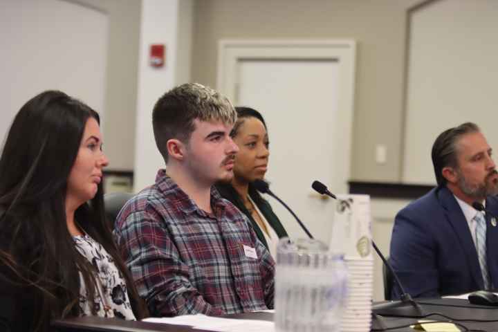 Amanda Hall and her son, Jayden Spence, testify in a Frankfort, KY committee room. Amanda Hall and her son, Jayden Spence, testify in a Frankfort, KY committee room.