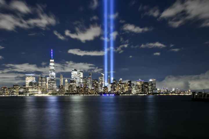 A photo of the Manhattan skyline with two lights where the World Trade Center Twin Towers used to be.