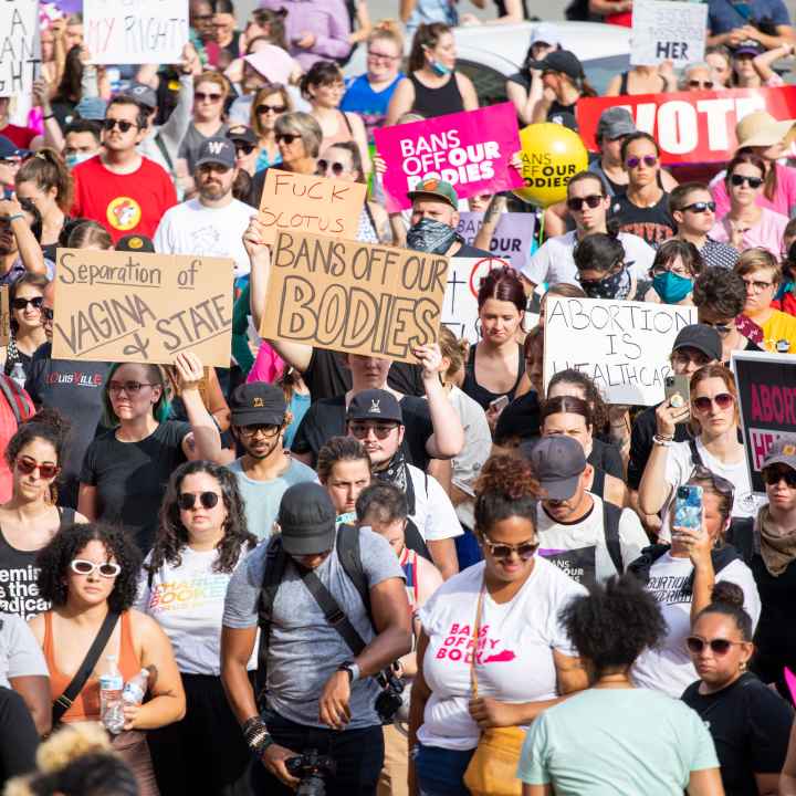 Abortion rights advocates holding protest signs 